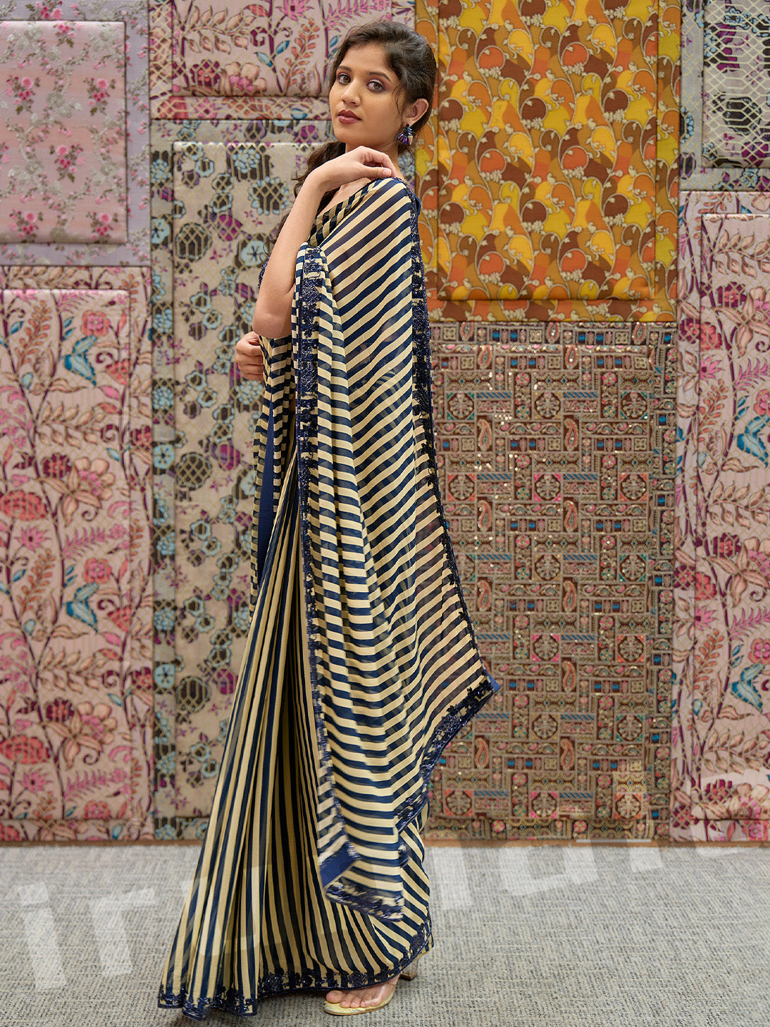 Black & Gold Printed Stripe Saree With Embroidered Sleeveless Choli