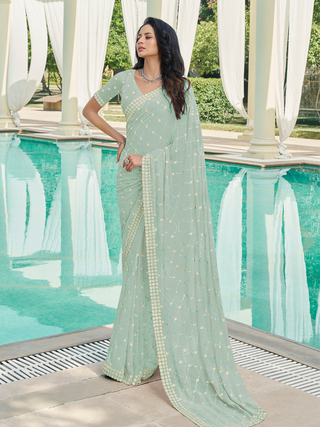 Exquisite Sea Green Georgette Embellished Saree